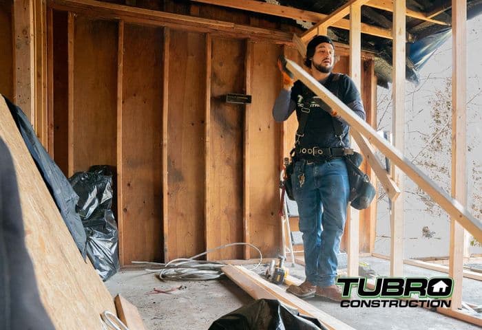A Tubro Construction team member at work on an active remodel job site