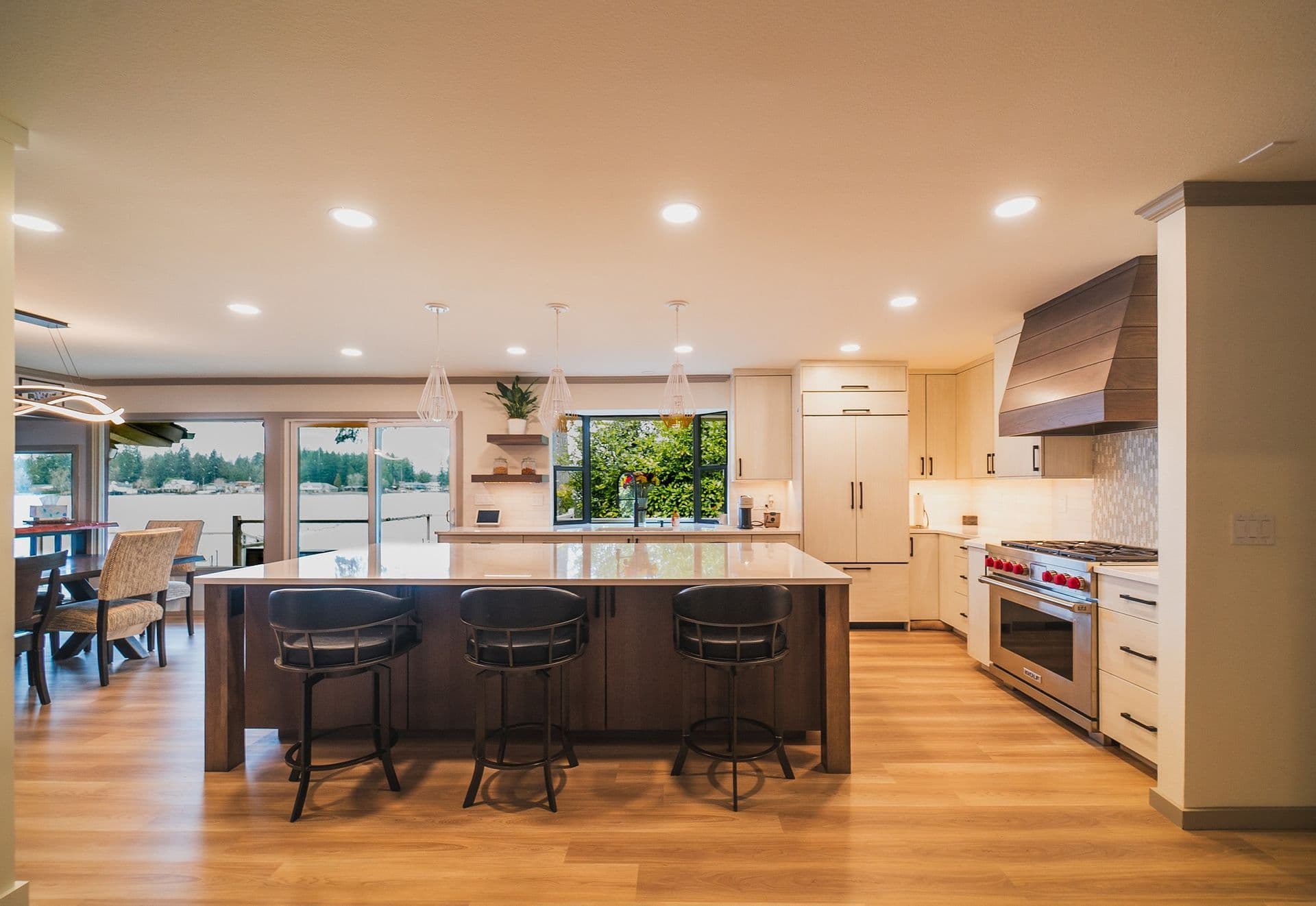 Completed custom kitchen remodel by Tubro Construction with a large island, quartz counters, and warm wood cabinetry