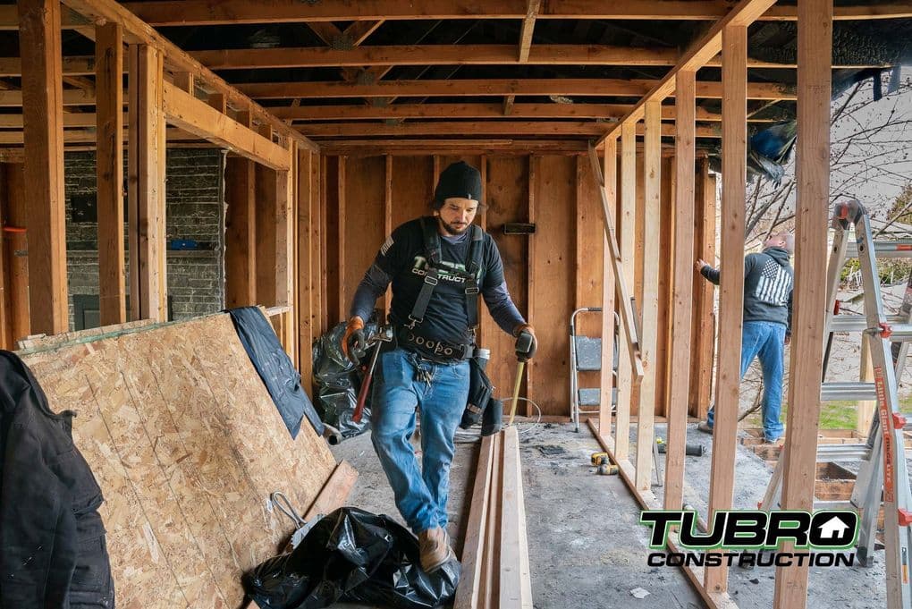 A Tubro Construction team member working on an active remodel job site